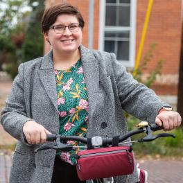 Woman wearing coat with bike