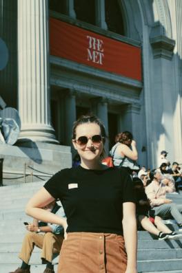 Woman in sunglasses in front of The Met