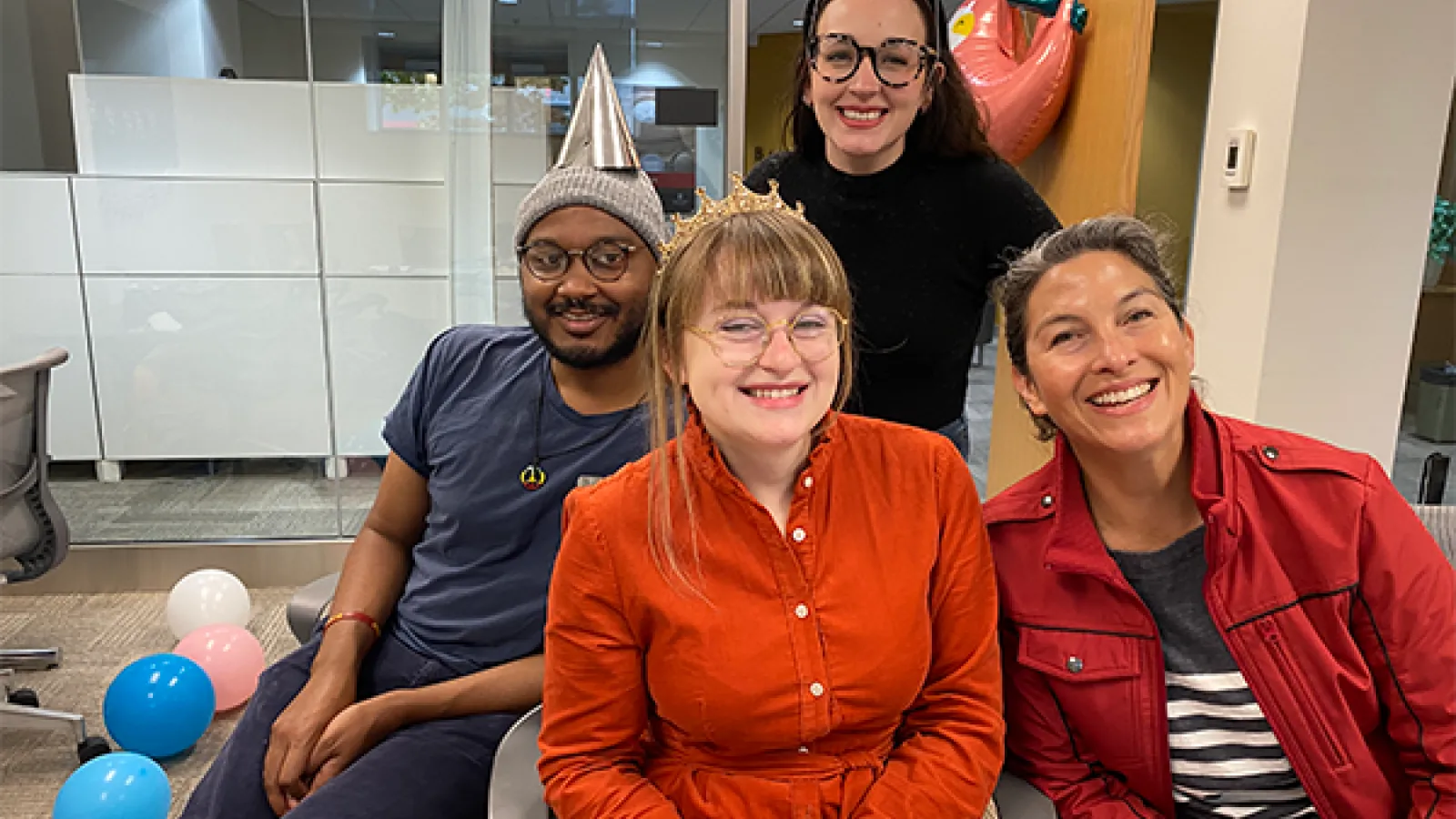 Barnett Fellows smile at camera during birthday celebration