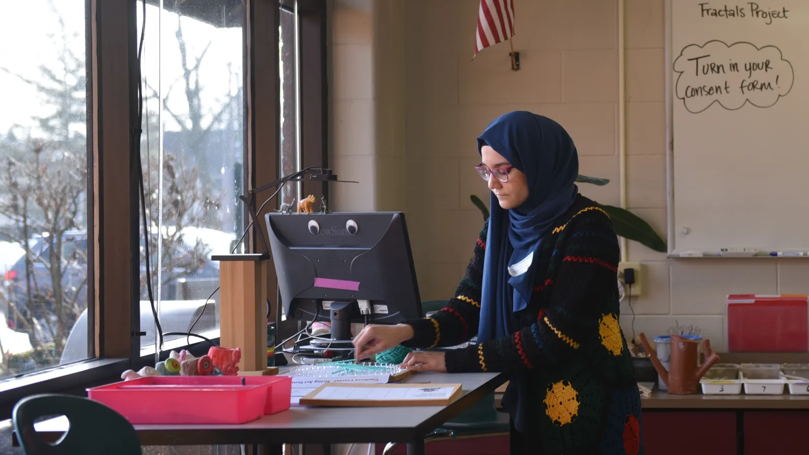 Noor Murteza working on her research at a computer
