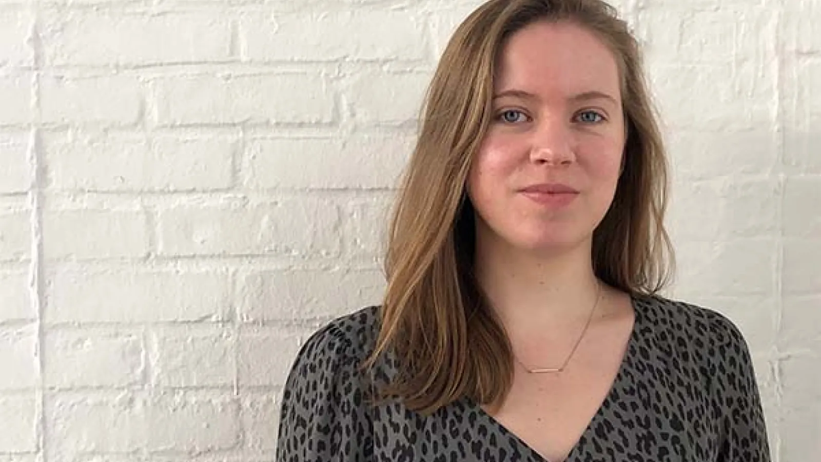Amanda Tobin Ripley in front of white wall