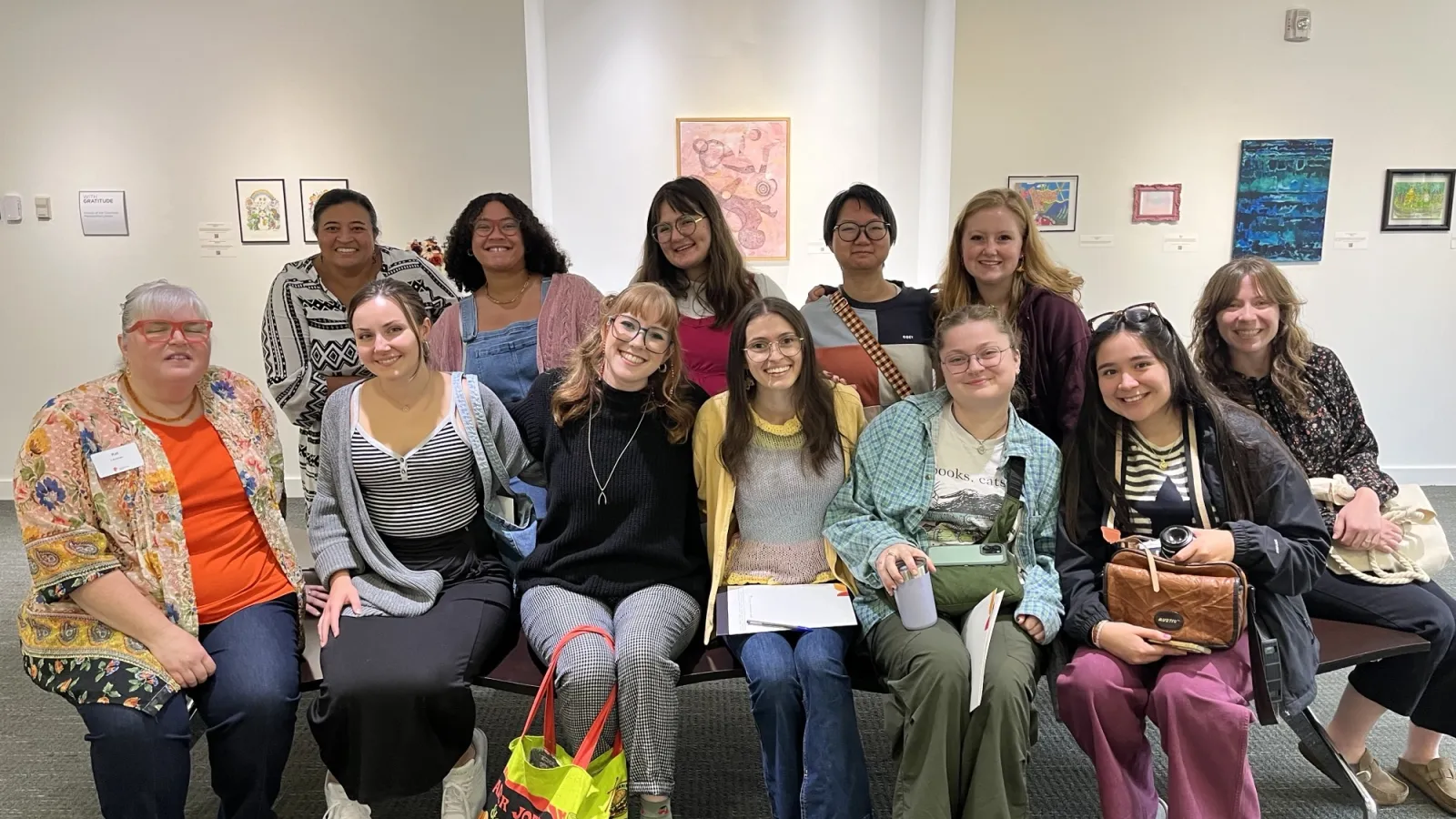 A group of students take a photo in a library