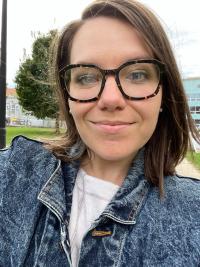 Rachel Skaggs wearing glasses and denim jacket