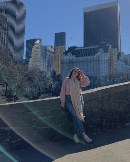 Woman in front of buildings