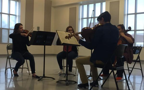 Students practicing violins