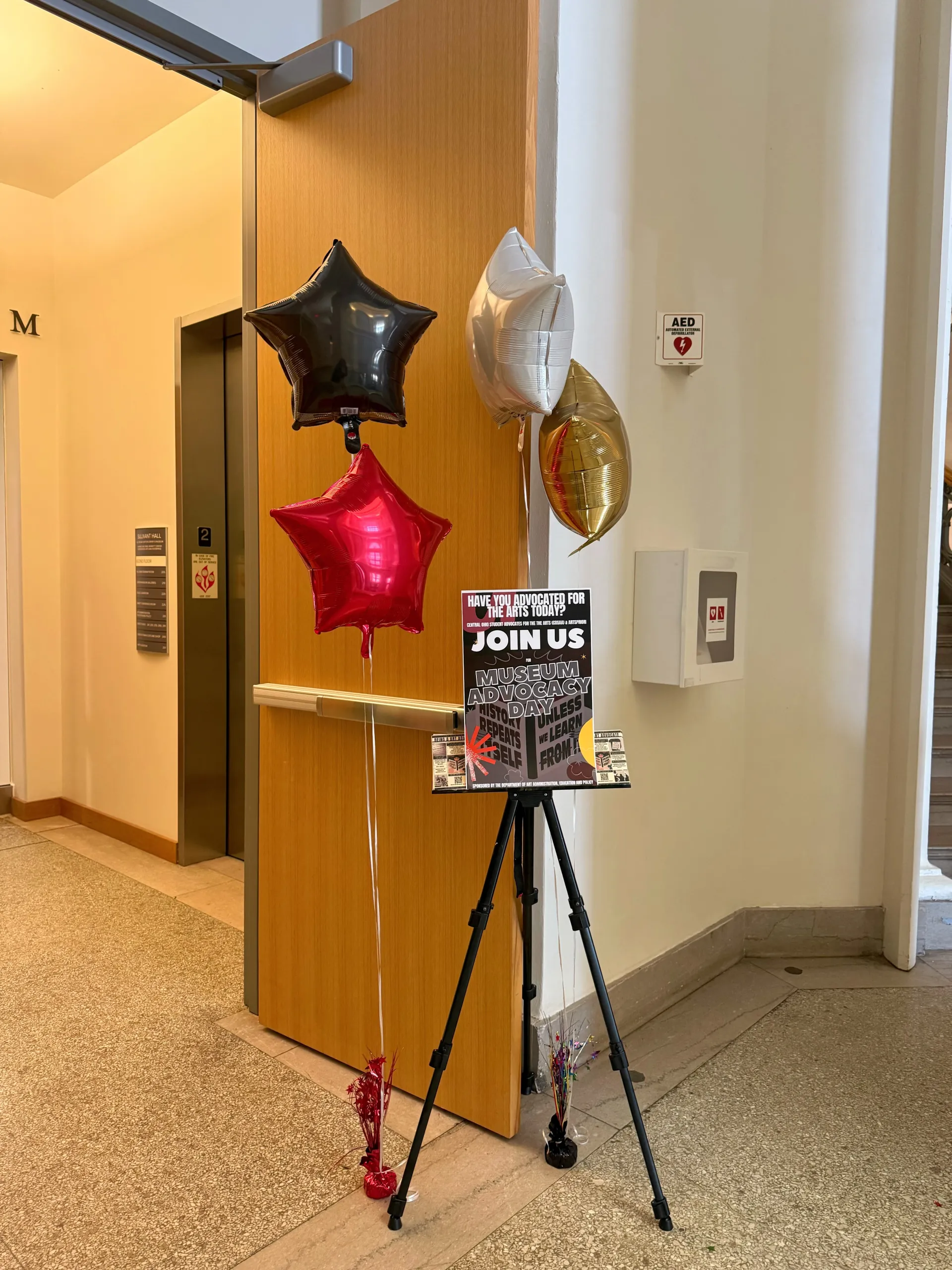Star balloons and sign that says museum advocacy day