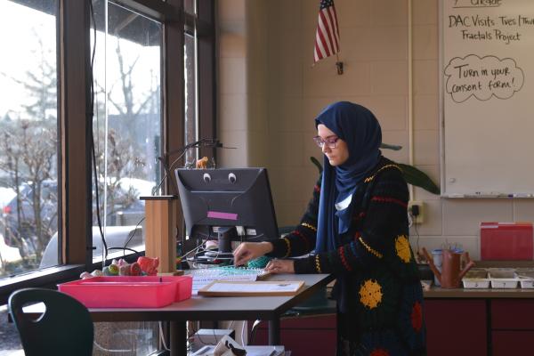 Noor Murteza working on her research at a computer
