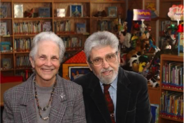 Sylvia and Kenneth Marantz, surrounded by books in the Marantz Picturebook Collection for the Study of Picturebook Art, Reinberger Children's Center at Kent State University (Photo courtesy of Kent State University School of Library Information Science) Sylvia and Kenneth Marantz