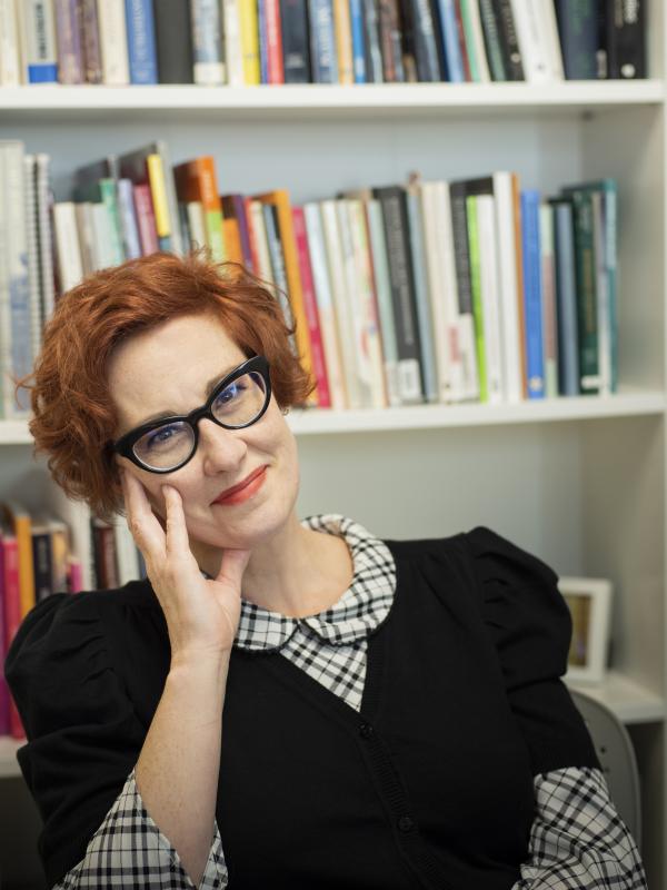 Photo of woman wearing glasses in an office