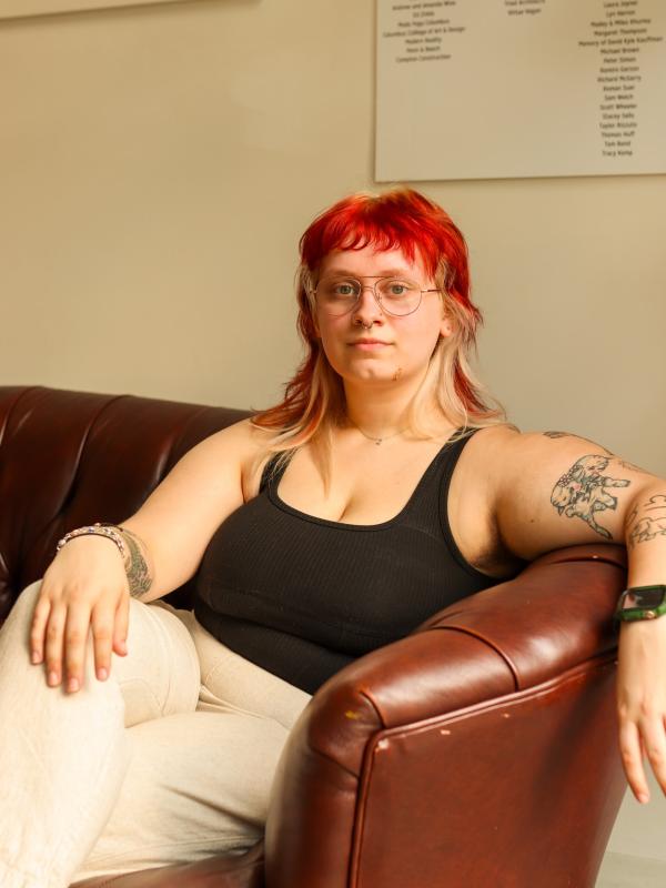 A person sitting on a leather sofa