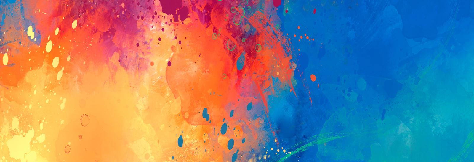 wall with orange, yellow, purple, red and blue paint on it